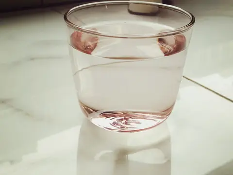 A glass of water on a marble counter