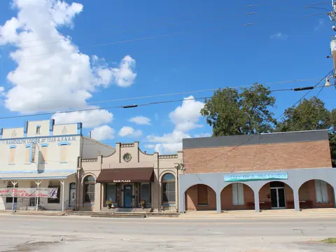 Historic buildings on Main Street in Schertz, Texas, under a blue sky