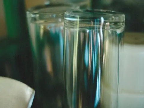 Two clear drinking glasses, close up